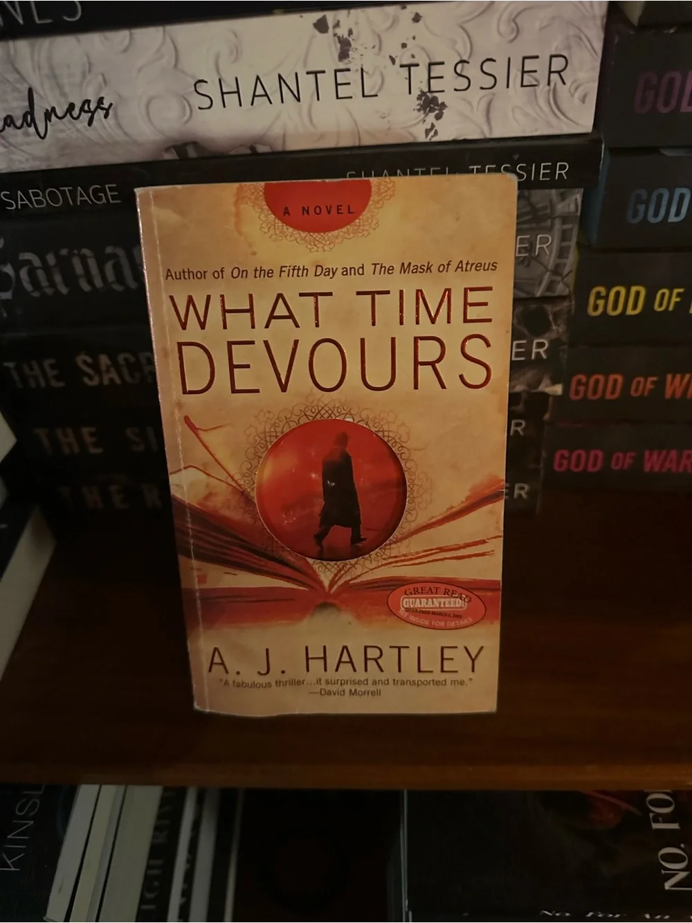 What Time Devours by A. J. Hartley - Beige/Red Paperback